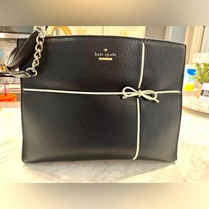 Black leather Kate Spade purse. Excellent condition. No spills or stains.